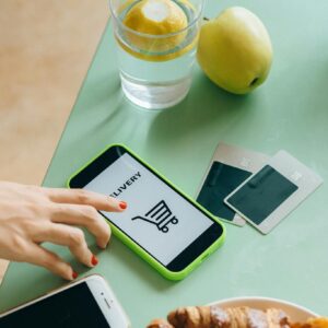 White Samsung Android Smartphone Beside Green Apple Fruit